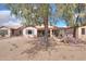 Private backyard with patio, desert landscaping, offering a tranquil and spacious outdoor area at 2453 E Hancock Trl, Casa Grande, AZ 85194