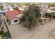 A backyard featuring desert landscaping, a mature tree, and backyard privacy at 2453 E Hancock Trl, Casa Grande, AZ 85194