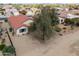 A backyard featuring desert landscaping, a mature tree, and backyard privacy at 2453 E Hancock Trl, Casa Grande, AZ 85194