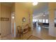 Inviting foyer with tiled floors, decorative furniture, and an open view into the living spaces at 2453 E Hancock Trl, Casa Grande, AZ 85194