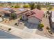 Charming single-Gathering home featuring well-kept landscaping, a two-car garage, and a classic red tile roof at 2453 E Hancock Trl, Casa Grande, AZ 85194