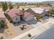 Inviting single-Gathering home featuring desert landscaping, a two-car garage, and classic tile roof at 2453 E Hancock Trl, Casa Grande, AZ 85194