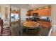 Kitchen with a granite breakfast bar and stainless appliances, including a double-door refrigerator at 2453 E Hancock Trl, Casa Grande, AZ 85194