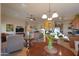 An open-concept living space features the kitchen, dining area, and living room at 2453 E Hancock Trl, Casa Grande, AZ 85194