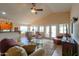 The living room is open to the kitchen and dining areas, promoting seamless interaction and flow at 2453 E Hancock Trl, Casa Grande, AZ 85194