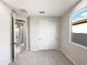 Neutral bedroom featuring carpet, a closet with slider doors, and natural light at 2526 E Novak Way, Phoenix, AZ 85042