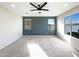 Bright bedroom with a ceiling fan and large windows that provide ample natural light at 2526 E Novak Way, Phoenix, AZ 85042