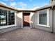 Inviting entryway featuring a red door, tiled floor, and bright windows at 2526 E Novak Way, Phoenix, AZ 85042