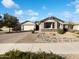 Charming single-story home with a three-car garage, desert landscaping, and a welcoming facade at 2526 E Novak Way, Phoenix, AZ 85042