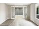 Spacious flex room with tile floor and glass doors, offering versatile space at 2526 E Novak Way, Phoenix, AZ 85042