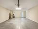 Spacious garage with epoxy floors, overhead lighting and a garage door opener at 2526 E Novak Way, Phoenix, AZ 85042