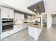 Modern kitchen featuring white cabinets, stainless steel appliances, and a large island at 2526 E Novak Way, Phoenix, AZ 85042