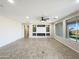 Spacious living room featuring neutral colors, a modern fireplace, and large windows for natural light at 2526 E Novak Way, Phoenix, AZ 85042