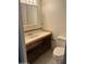 This is a view of a bathroom with vanity, toilet, and medicine cabinet at 2530 W Berridge Ln # E102, Phoenix, AZ 85017