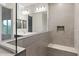 Bathroom featuring double vanity with modern faucets, and shower with a built-in seat at 2658 N Coronado Dr, Florence, AZ 85132