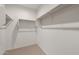 Walk-in closet with shelving and rods for ample storage space at 2658 N Coronado Dr, Florence, AZ 85132