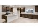 Spacious kitchen with granite countertops, dark cabinets and a large central island at 2658 N Coronado Dr, Florence, AZ 85132