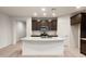 Modern kitchen featuring granite countertops, dark cabinets, and stainless steel appliances at 2658 N Coronado Dr, Florence, AZ 85132