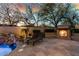 Backyard pool and patio with rock waterfall feature, fireplace, and lounge seating perfect for outdoor entertaining at 27708 N 110Th Pl, Scottsdale, AZ 85262