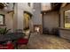 Relaxing courtyard featuring a tiled fireplace, cozy seating, and a charming, private outdoor space at 27708 N 110Th Pl, Scottsdale, AZ 85262