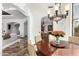Elegant dining room with a chandelier, access to living spaces, and seating for six at 27708 N 110Th Pl, Scottsdale, AZ 85262
