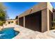 Exterior view of the home with a pool and screened in patio area at 27708 N 110Th Pl, Scottsdale, AZ 85262