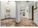 Elegant foyer boasts marble floors with decorative inlay and arched doorways leading to living spaces at 27708 N 110Th Pl, Scottsdale, AZ 85262