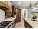 Gourmet kitchen with custom cabinets, stainless steel appliances, and a large center island at 27708 N 110Th Pl, Scottsdale, AZ 85262