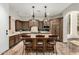 Gourmet kitchen with a large island, custom cabinets, and stainless steel appliances at 27708 N 110Th Pl, Scottsdale, AZ 85262