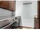 This is a laundry room with upper cabinets and a Samsung washer and dryer at 27708 N 110Th Pl, Scottsdale, AZ 85262