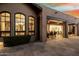 Beautiful living area featuring open-concept living and large windows overlooking manicured outdoor landscape at 27708 N 110Th Pl, Scottsdale, AZ 85262