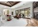 Bright living room with patio access, fireplace, and comfortable seating arrangement at 27708 N 110Th Pl, Scottsdale, AZ 85262