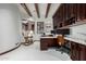 Home office featuring custom cabinets, granite countertops, and a comfortable rocking chair at 27708 N 110Th Pl, Scottsdale, AZ 85262