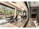 The expansive patio features a fireplace, seating, and a view of the pool area at 27708 N 110Th Pl, Scottsdale, AZ 85262