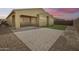 The home has a private backyard with a covered patio, artificial grass, and desert views at 32366 N 133Rd Ln, Peoria, AZ 85383