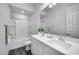 A clean and bright bathroom featuring a double vanity and shower-tub combination, for added convenience at 32366 N 133Rd Ln, Peoria, AZ 85383