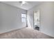 A bright bedroom leads to an ensuite bathroom, creating a private and convenient layout at 32366 N 133Rd Ln, Peoria, AZ 85383