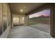 Covered patio with sliding glass doors offers seamless indoor-outdoor living with beautiful desert views at 32366 N 133Rd Ln, Peoria, AZ 85383