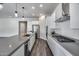 Modern kitchen featuring stainless steel appliances, a large island, and pendant lighting at 32366 N 133Rd Ln, Peoria, AZ 85383