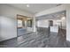 Open concept living space with tile flooring, recessed lighting, and easy access to the kitchen and patio at 32366 N 133Rd Ln, Peoria, AZ 85383