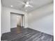 A cozy living room with contemporary flooring leads to a bathroom, creating a functional layout at 32366 N 133Rd Ln, Peoria, AZ 85383