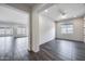 Bright, open-concept living space with sleek flooring and natural light, perfect for modern living at 32366 N 133Rd Ln, Peoria, AZ 85383