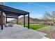 Outdoor patio with a pergola, modern furniture, artificial grass, and mountain views at 32366 N 133Rd Ln, Peoria, AZ 85383