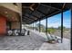 The covered patio offers multiple lounge spaces and an open view of the common areas at 32366 N 133Rd Ln, Peoria, AZ 85383