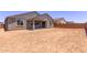 A partially-fenced backyard with potential for landscaping at 40499 W Michaels Dr, Maricopa, AZ 85138