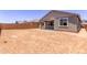 Expansive backyard showing the home's exterior and block wall at 40499 W Michaels Dr, Maricopa, AZ 85138