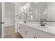 A luxurious bathroom featuring a double vanity and modern fixtures at 40499 W Michaels Dr, Maricopa, AZ 85138
