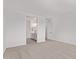 Bedroom leading to a bright bathroom with vanity and great natural light at 40499 W Michaels Dr, Maricopa, AZ 85138