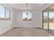 Sunny dining room with bright light and tile flooring at 40499 W Michaels Dr, Maricopa, AZ 85138