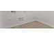 Well-lit laundry room with tile flooring and appliance hookups at 40499 W Michaels Dr, Maricopa, AZ 85138
